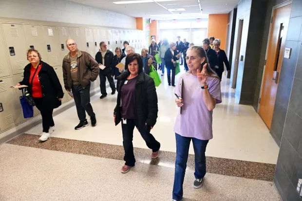 Stacey Brennan, right, of the Spring Drive Center, and Kim Haas, left, center director, lead participants in a walking bingo exercise during the 19th annual Boyertown Wellness Fair on Saturday, March 14, 2026, at Boyertown Area Senior High School.