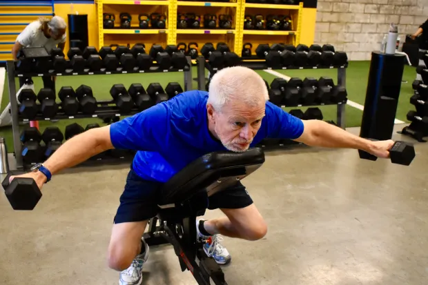 Gary Holter, 71, of Naperville enjoys working out at Beyond Measure Fitness Training in Naperville. A customer for more than a year, he likes the variety of options available, he says. (Steve Metsch/Naperville Sun)