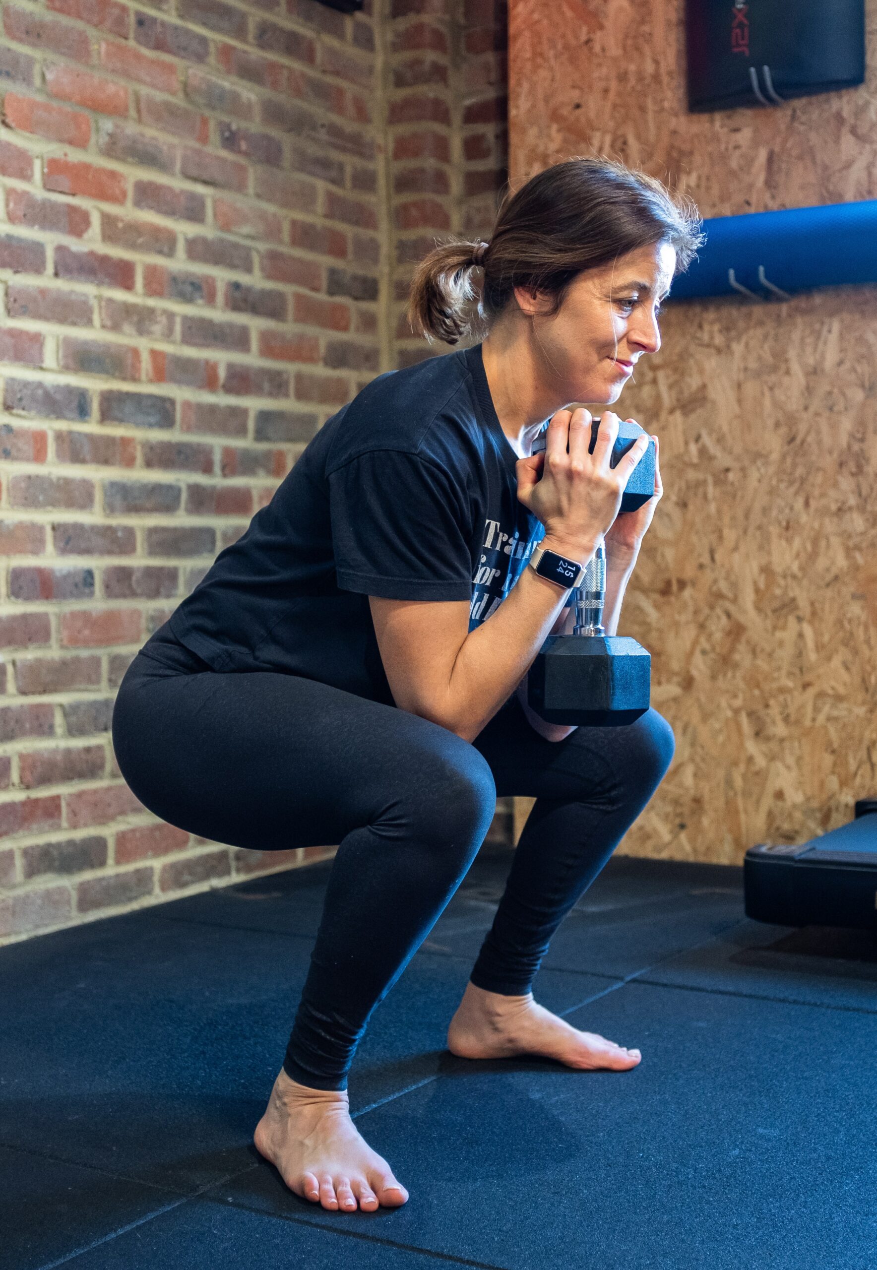 Elizabeth Davis doing dumbbell squats.