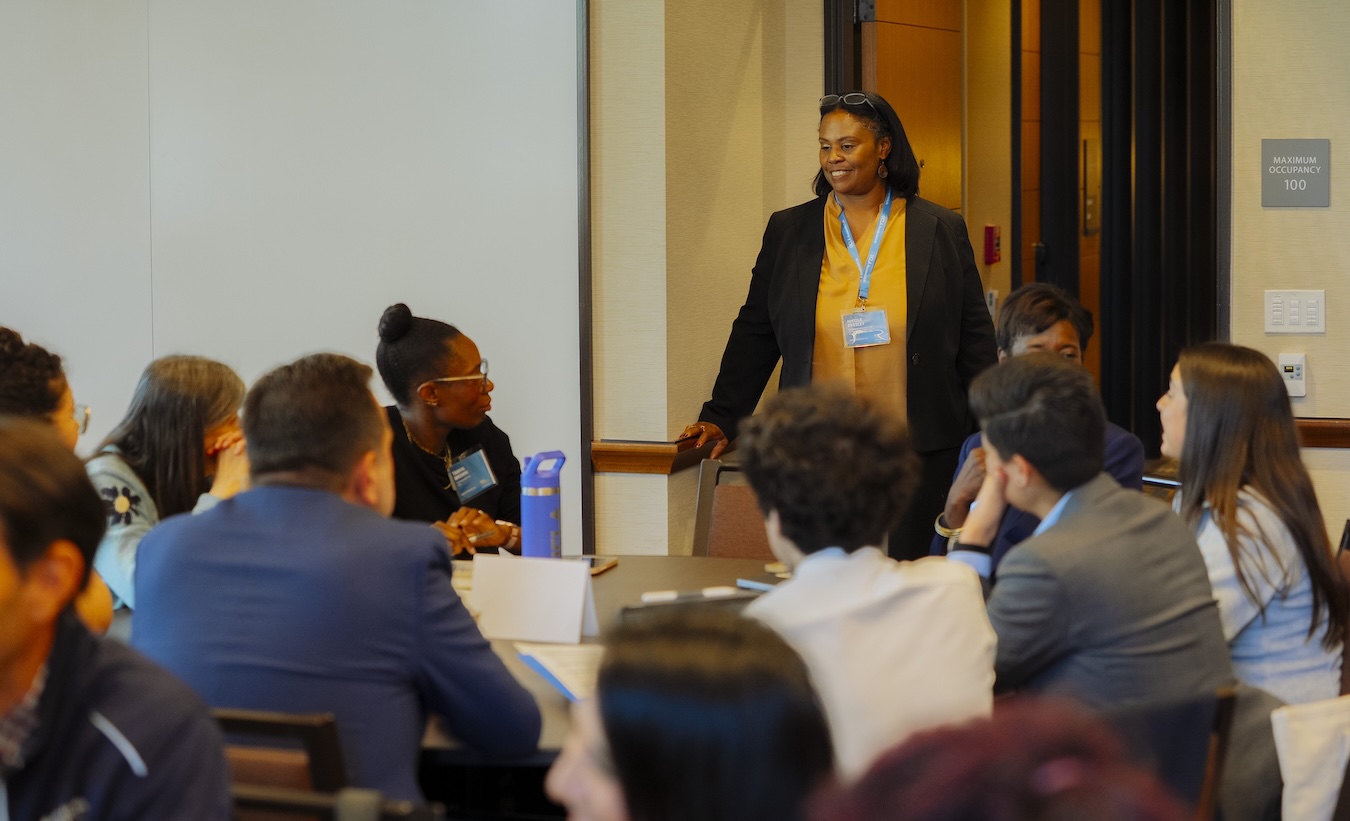 Hope Connects Us- Nicole Presley talks to an attendee at a mental health event