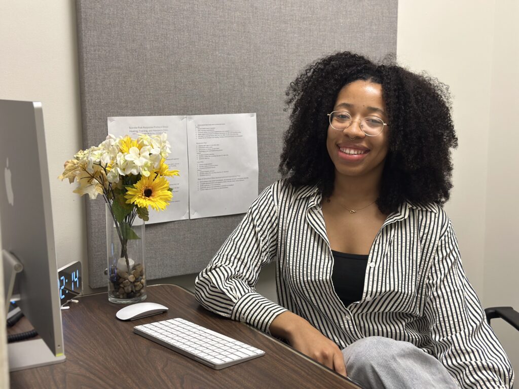 A woman is sitting at a table