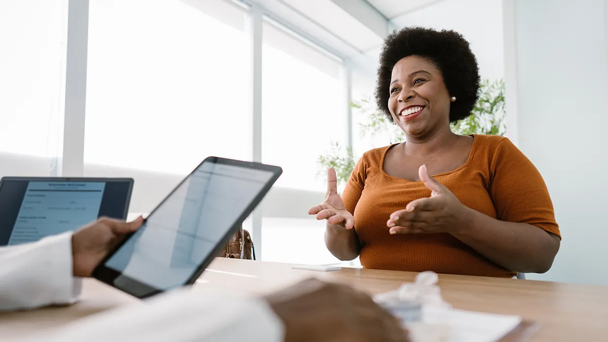 A nutritionist consults with a client in an office setting